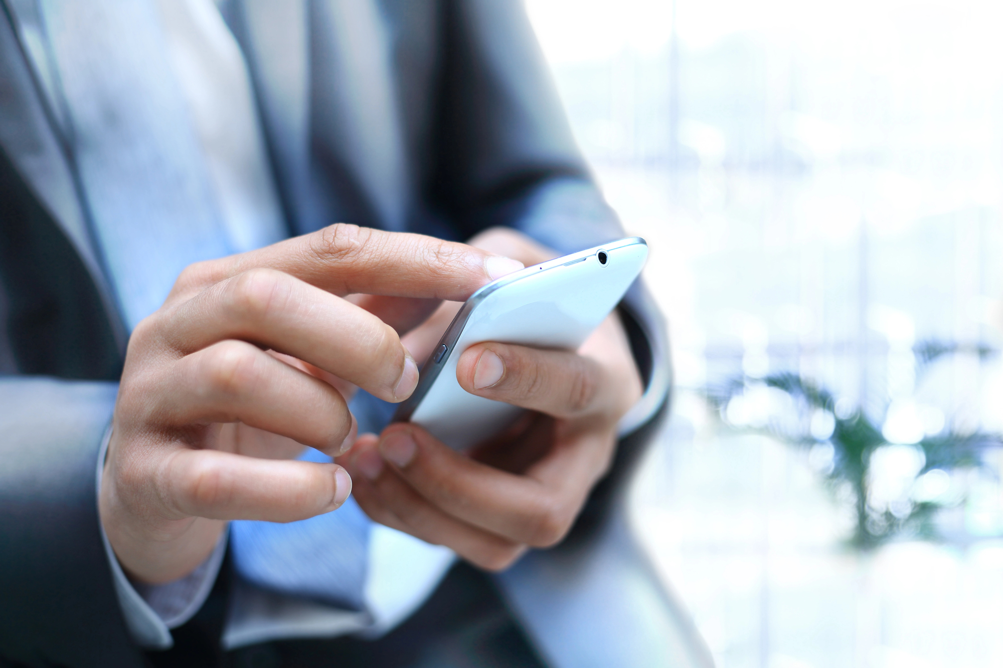 real estate agent with smartphone